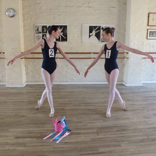 2 dancers pausing before their G4 exam
