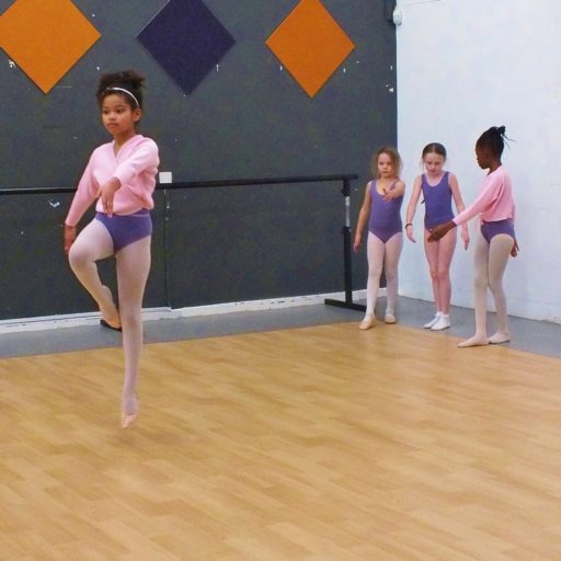 ballet class young dancer jumping with other getting ready